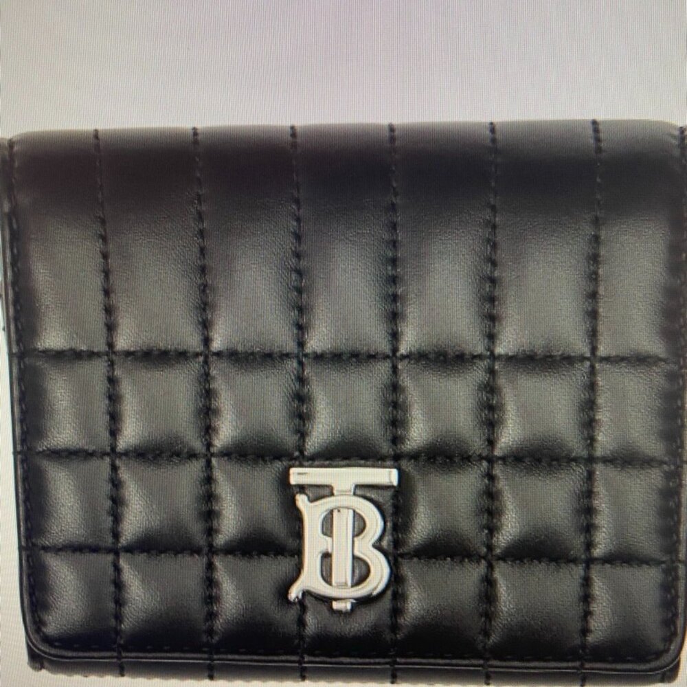 Burberry Italian leather Lola Lambskin Wallet like new with the duster.